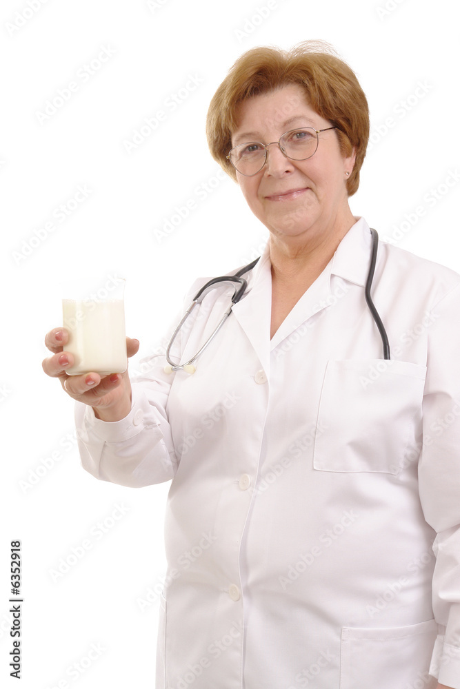 Senior female doctor holding glass of milk isolated on white Senior female doctor holding glass of milk isolated on white