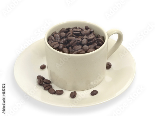 Coffee beans in creme cup.