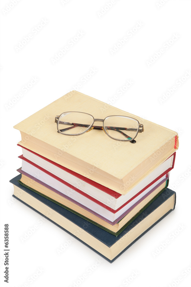 glasses on pile of books