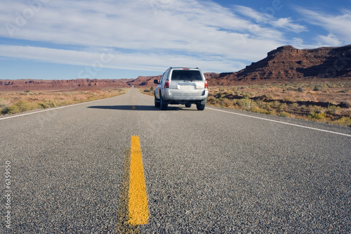 Silver SUV driving in Utah. photo