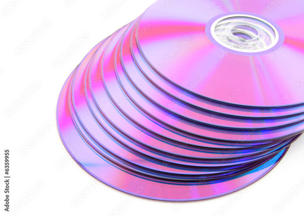 Stack of vibrant purple CDs on white background. No dust. Stack of vibrant purple CDs on white background. No dust.