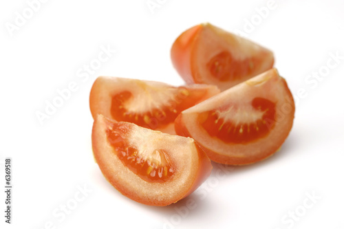 Pieces of sunny tomatoes on white (with path)