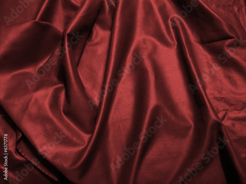 close up photo of a wine colored satin sheet