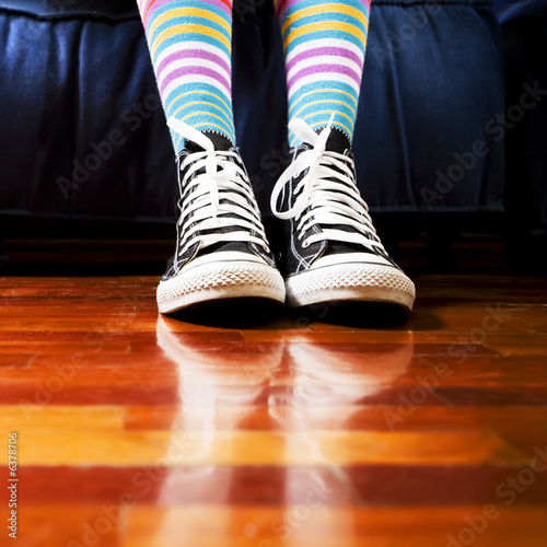 girl in a waiting room. Close up of her footwear