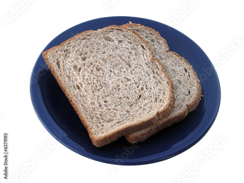 Two slices of wheat bread isolated on white