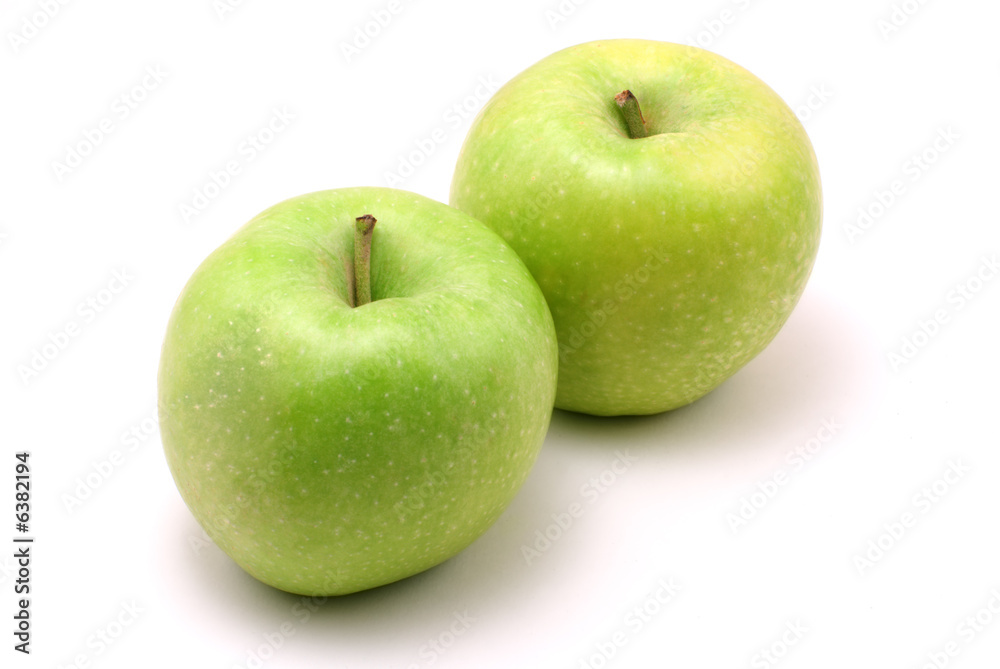 two fresh, green apples on white