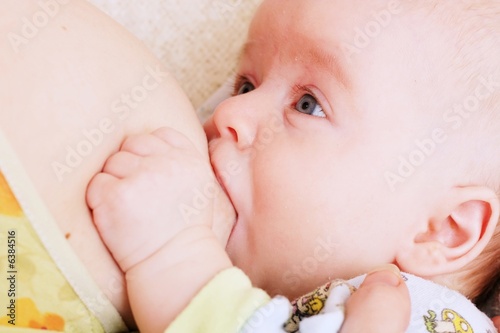 Beautiful baby beeing breastfed
