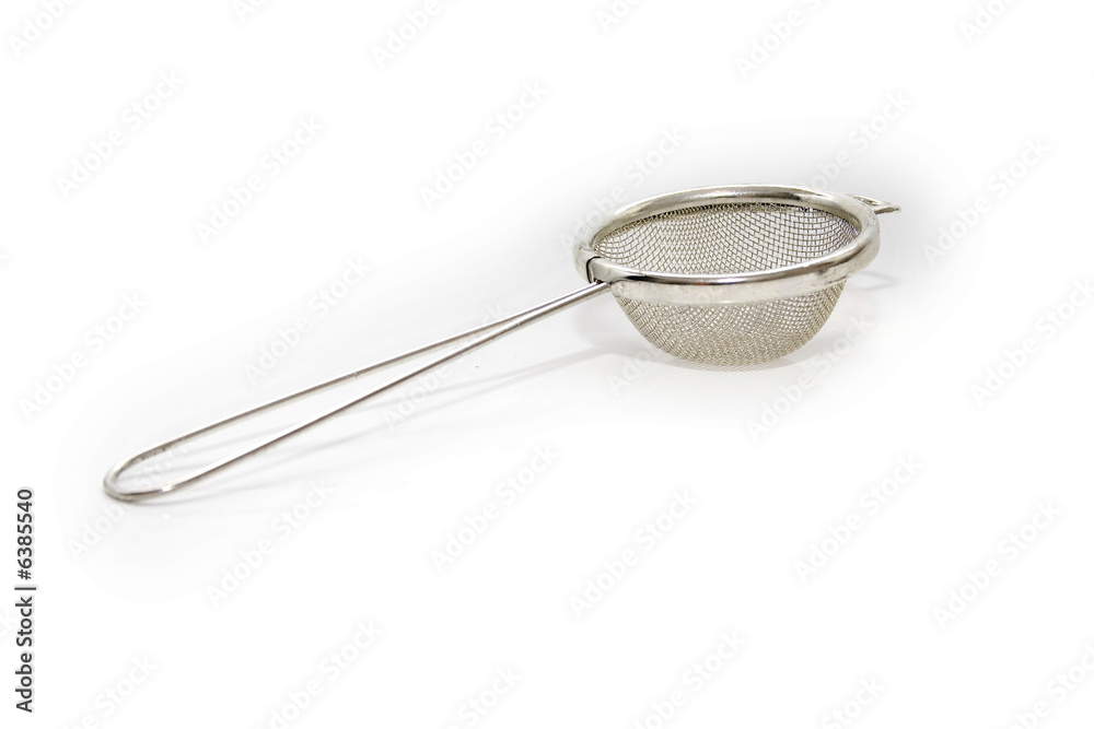 silver tea strainer isolated on white silver tea strainer isolated on white
