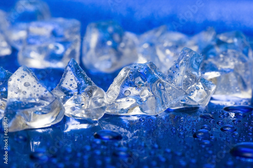 close-up of ice cubes on blue