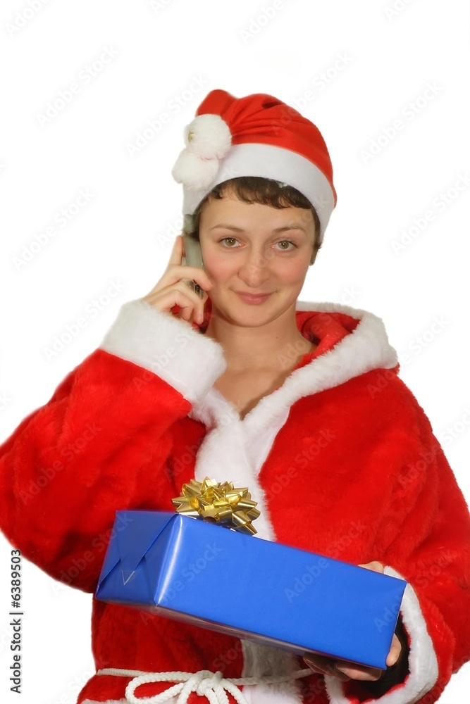 Telefonierende Weihnachtsfrau mit einem Geschenk Telefonierende Weihnachtsfrau mit einem Geschenk