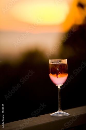 Shot of a glass of wine to enjoy the sunset with.