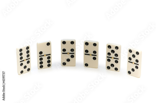 Various domino pieces isolated on the white