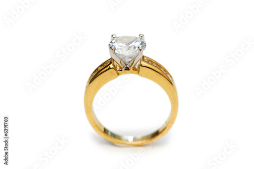 Golden ring with diamond isolated on the white