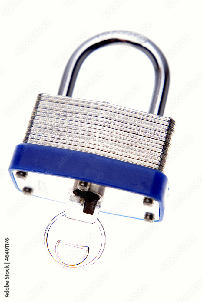 Padlock and key isolated over white Padlock and key isolated over white