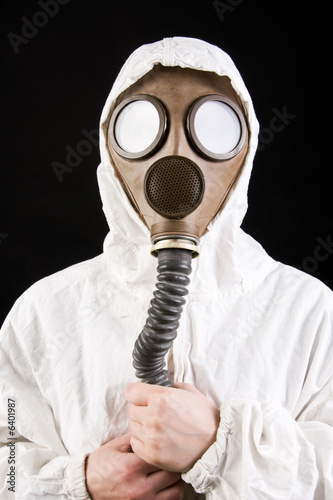 Person in gas mask on dark background