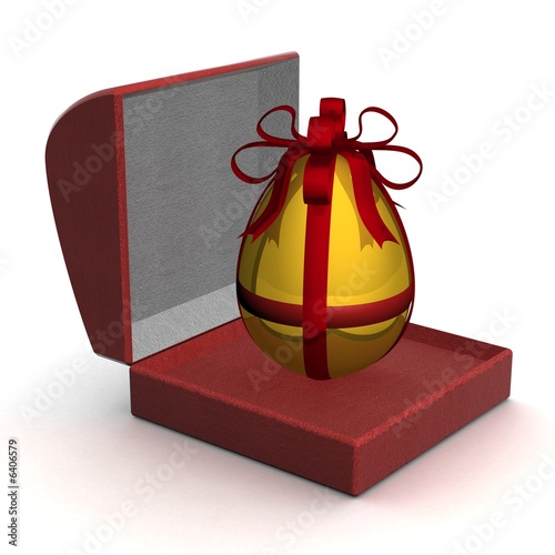 Gold egg in gift packing. 3...