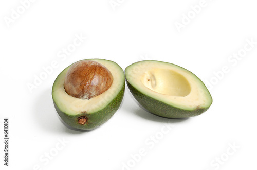 Sliced avocado over white background photo