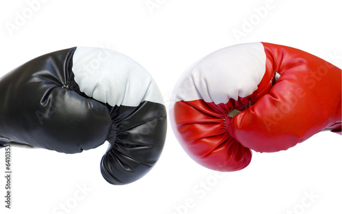 Red and black boxing gloves competition isolated over white