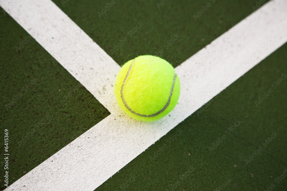 A shot of a tennis ball in tennis court