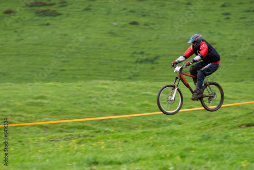 Blurred motion fly on downhill mountain bike race