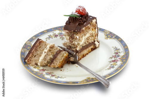 Tasty, chocolate cake with cherry on white