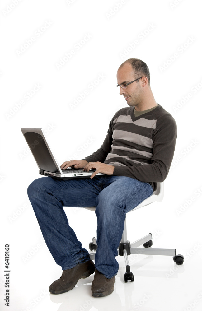 Buziness man seated on chair and working on a laptop