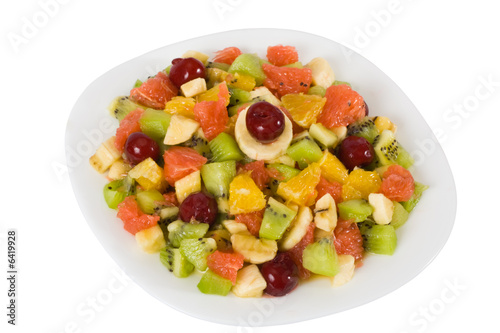 Colorful fruit salad isolated on white