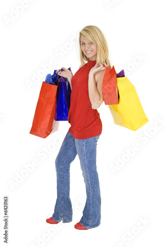 Beautiful Caucasian teen holding shopping bags 