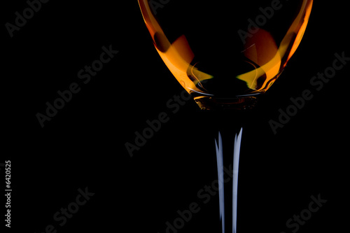 full wine glass on the black background