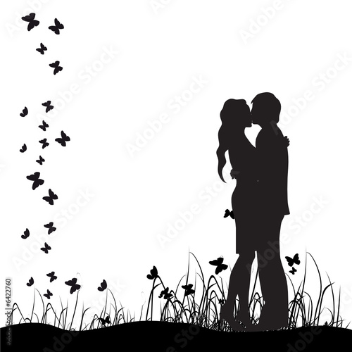 Couple kisses on a meadow, black silhouette