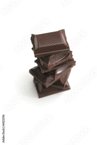 It is a lot of segments of chocolate on a white background