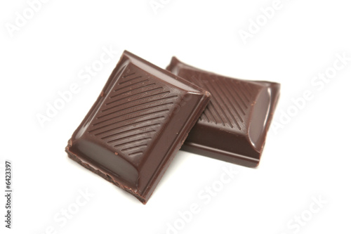 Two segments of chocolate on a white background