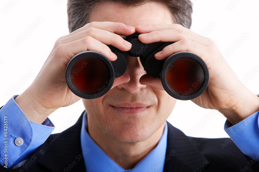 business man with binoculars looking to the future. business man with binoculars looking to the future.