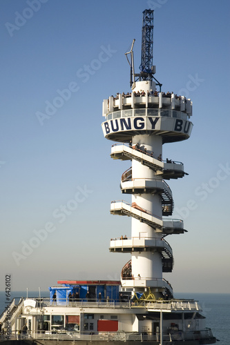 tower at the pier used for bungee-jumping photo