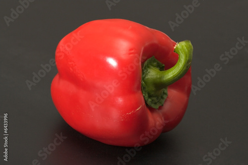 Red pepper on a black background