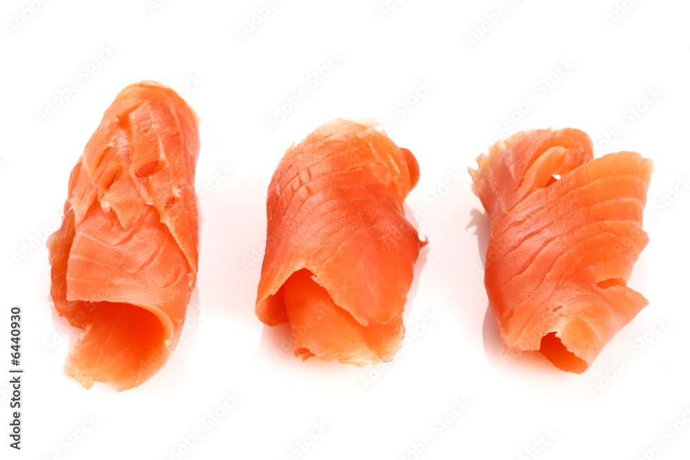 three pieces of smoked salmon on white, light shadow three pieces of smoked salmon on white, light shadow