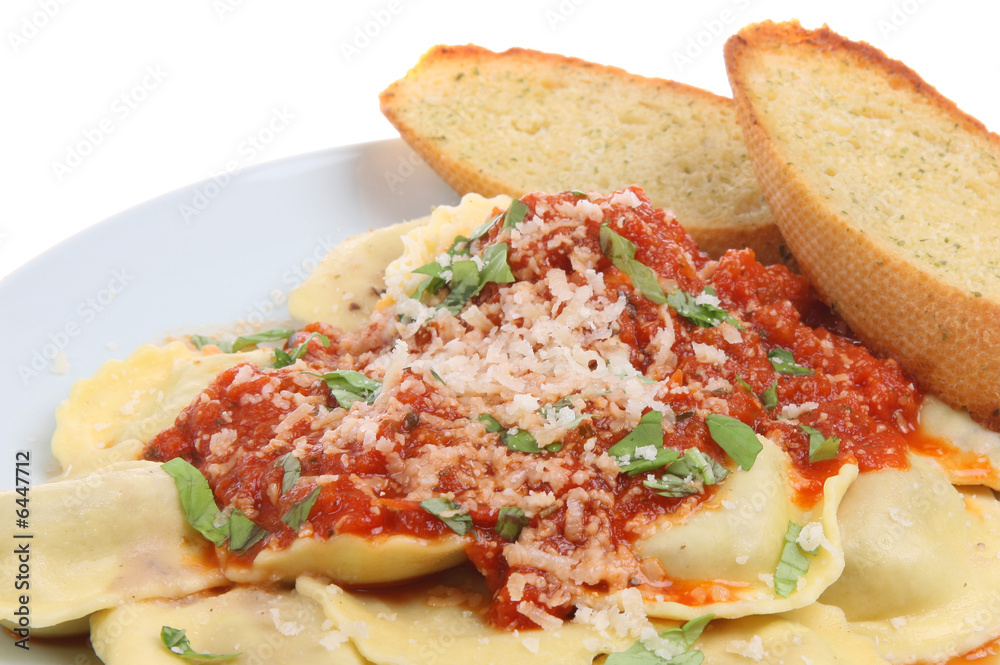 Ravioli pasta with a tomato sauce and garlic bread Ravioli pasta with a tomato sauce and garlic bread