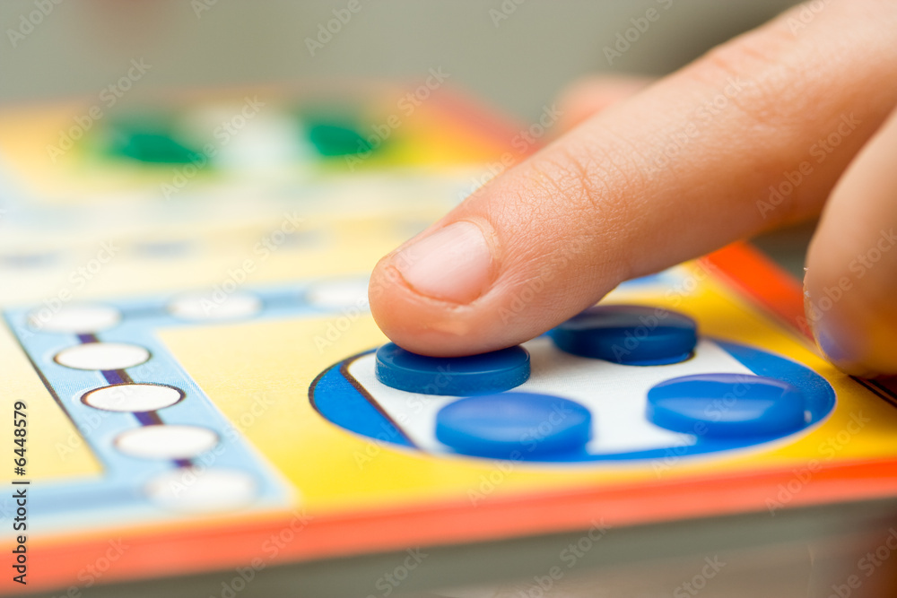 Funny board game played with colored buttons Funny board game played with colored buttons