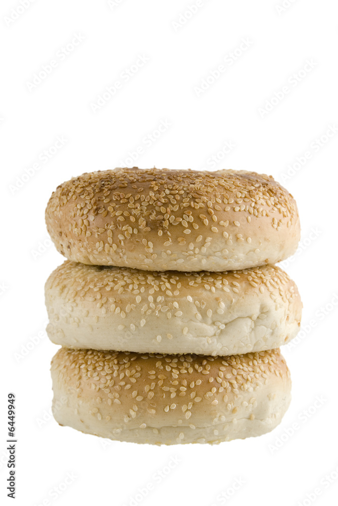 A line up of three bagels isolated on a white background A line up of three bagels isolated on a white background