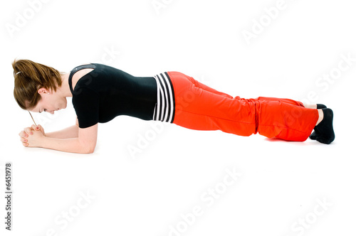 A young caucasian girl doing different stretches