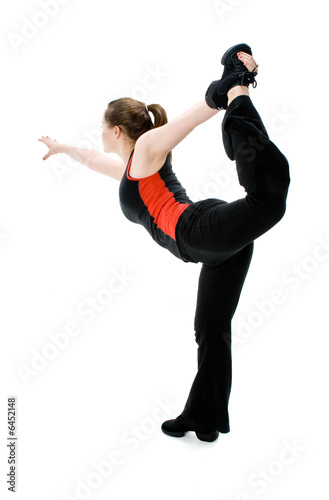 A young caucasian girl doing different stretches