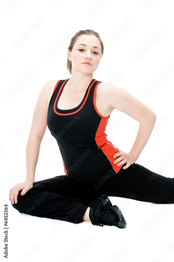 A young caucasian girl doing different stretches A young caucasian girl doing different stretches