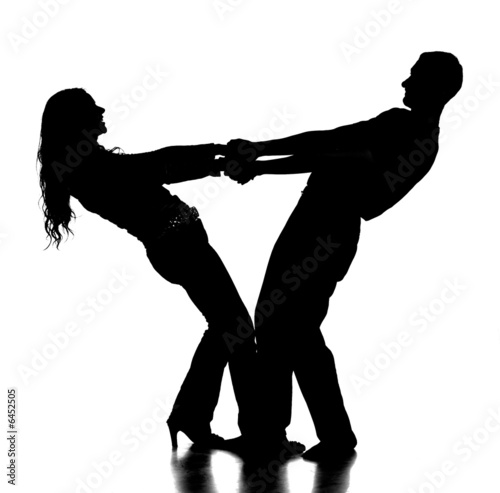 silhouette of happy young couple holding by hands