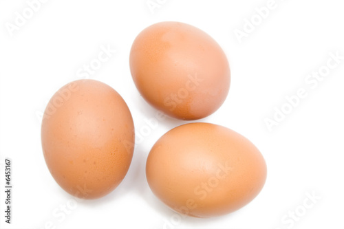 three eggs on the white isolated background
