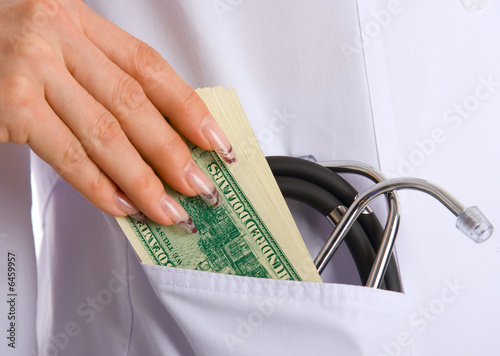 hand with bribe to doctor