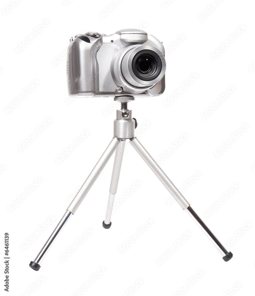 Modern digital camera with tripod. Isolated on white. Modern digital camera with tripod. Isolated on white.