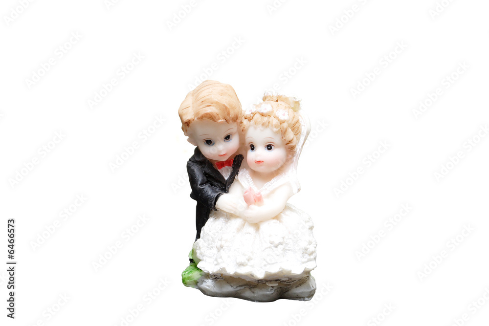 ceramic figures of children dressed as a bride and groom