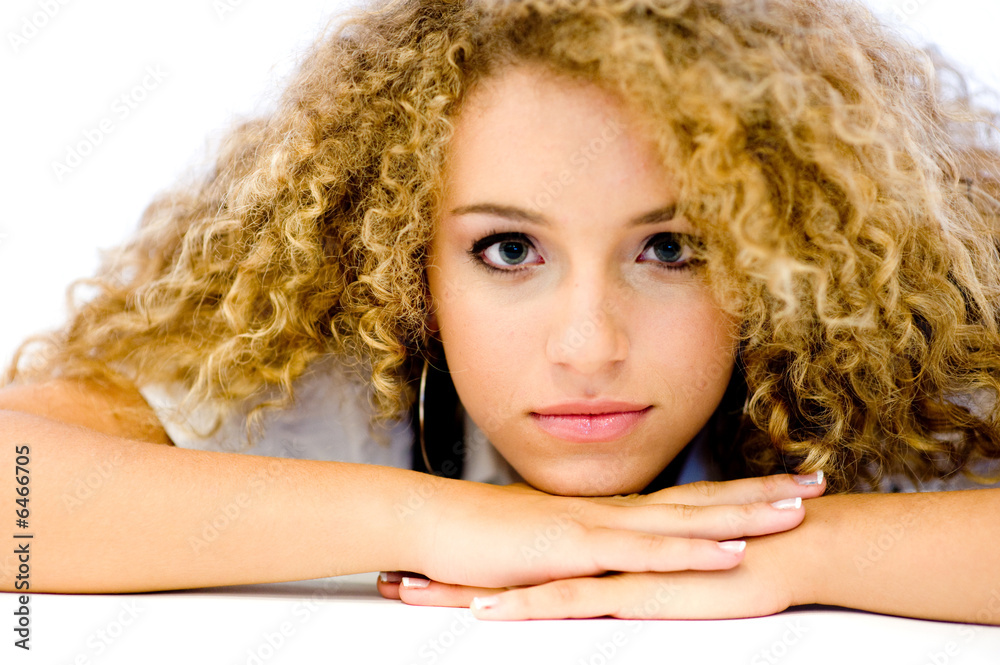 An attractive young woman with great curly hair An attractive young woman with great curly hair