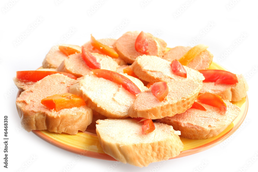 On a photo a sandwiches with caviar and a tomato. It is isolated On a photo a sandwiches with caviar and a tomato. It is isolated