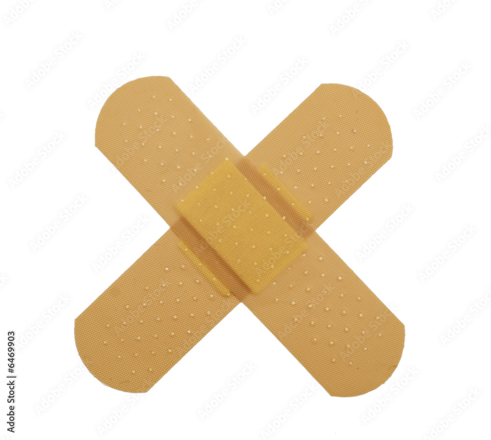 Crossed bandaid isolated over white Crossed bandaid isolated over white